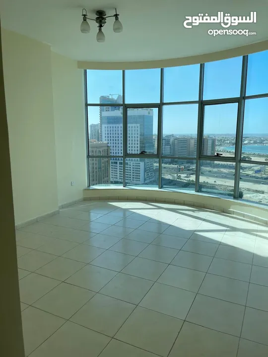 Directly from the Owner : Spacious 2BR Apartment  Sea View  1 Car Parking Free  On Dubai Border