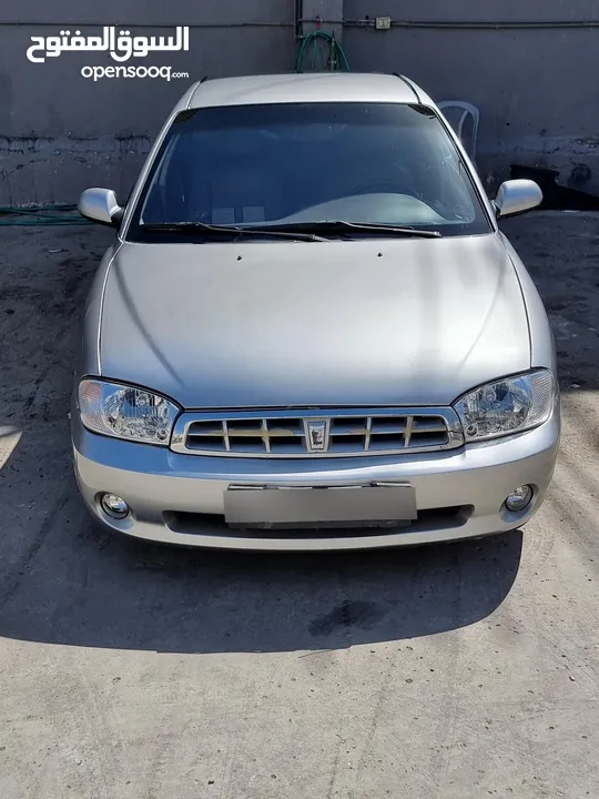 كيا سبيكترا 2001 بسعر 2400 جير عادي سياره نظيفه جدا  kia spectra 2001