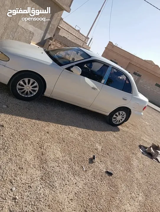 جنط 14حديد مع طاسات كوشوك امامي نظيف خلفي نص عمر البدل