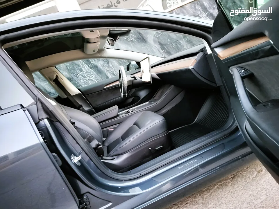 تيسلا 2023 MODEL 3 فحص كامل 4 جـيـد ممشى قليل 20 الف بحالة الوكالة لون فيراني مميز بسعر محرووق ولقطة