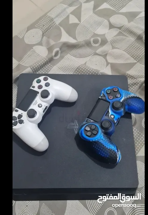 playstation 4 slim 500gb with 2 controllers and 7 games