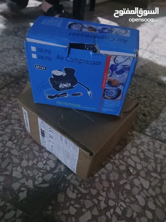 شاحن بطارية سيارة مع منفاخ عجل السيارة جديد مش مستعمل للبيع ......