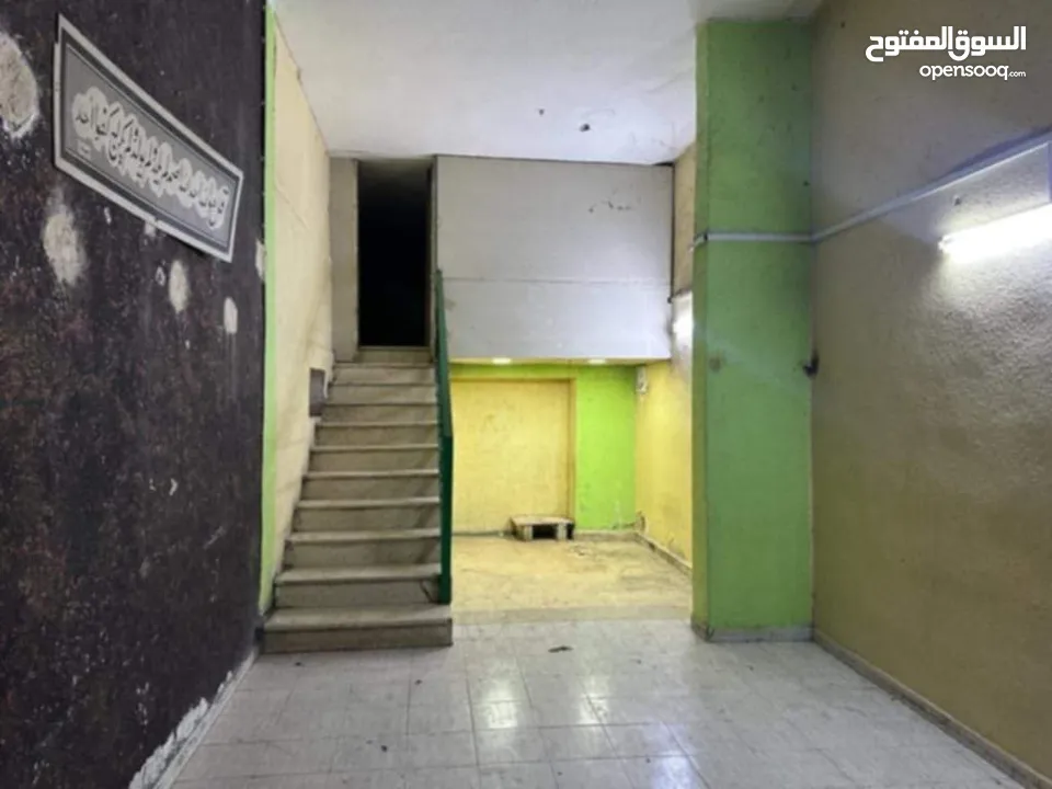 عمارة وسط السوق التجاري بين شارع السعادة وشارع الملك عبدالله