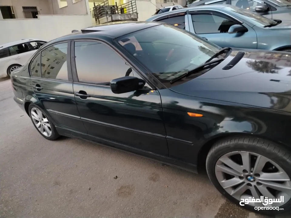 للبيع Bmw e46 2004  لون اخضر زيتي بجننن مع فتحة  دهان جديد السيارة كرتونة