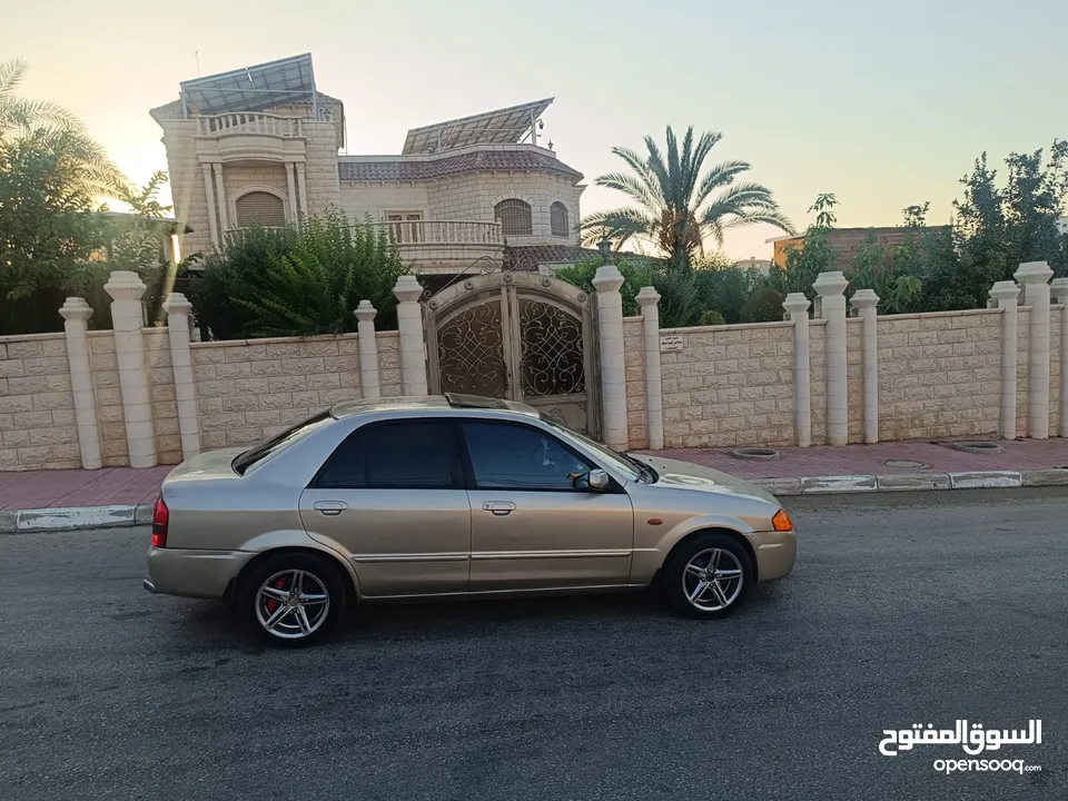 مازدا 323 اتماتك فتحه اصليه تحفه بمعنا الكلمه بسعر حرق 29500 ألف نقدا بدل وارد فحص نخب