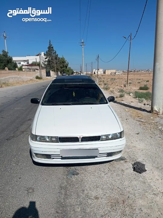 متسوبيشي ميراج 1990 ابيض باب واحد