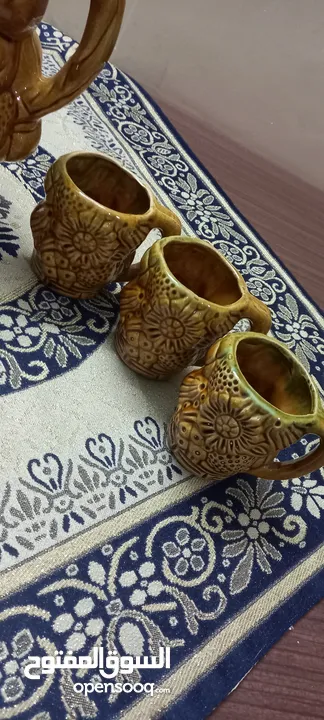 طقم ابريق و 6 كاسات فخار انتيك