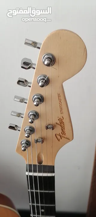Fender electric guitar stratocaster replica with 10 watt amplifier.