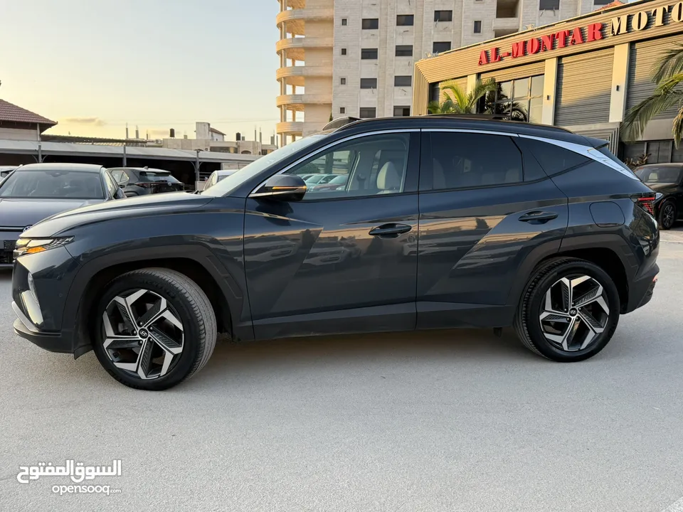 هونداي توسان ترخيص 2022 محرك 1600 هايبرد plug in/يقطع على الشحنه 65 كيلو متر  271 حصان