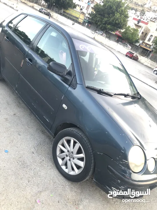 polo 2003  اللون الزيتي
