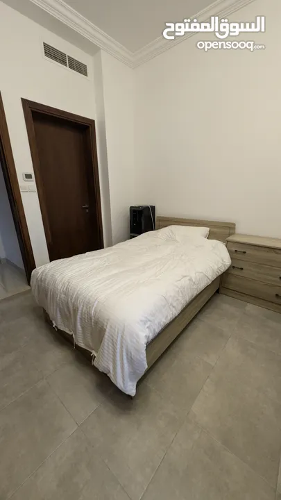 Two single mattresses with mattress topper and bed frames