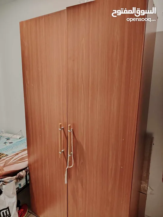 wooden cabinet خزانه خشب ، metal bed سرير حدي ،  wooden Drawers  وحده أدراج خشب