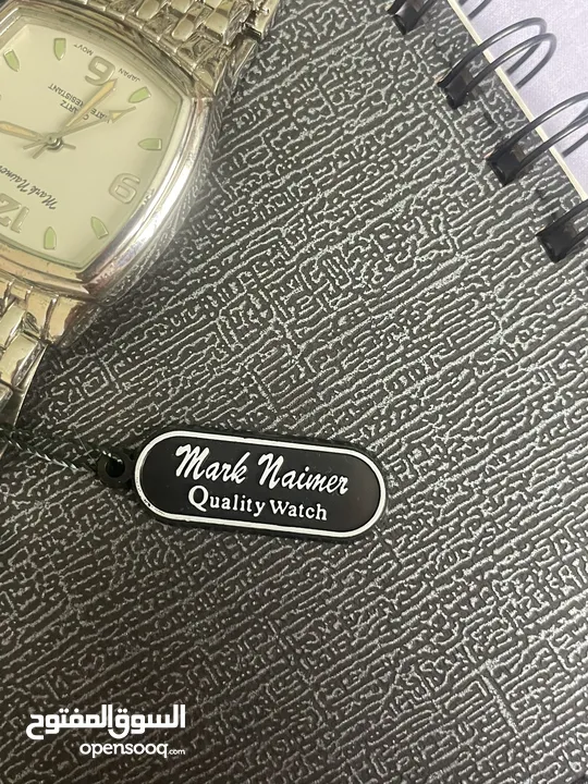 ساعة mark naimer يابانية ستانلس ستيل ضد الماء عقارب عادية فضية و بيضاء من الداخل و يوجد تفاصيل خضراء