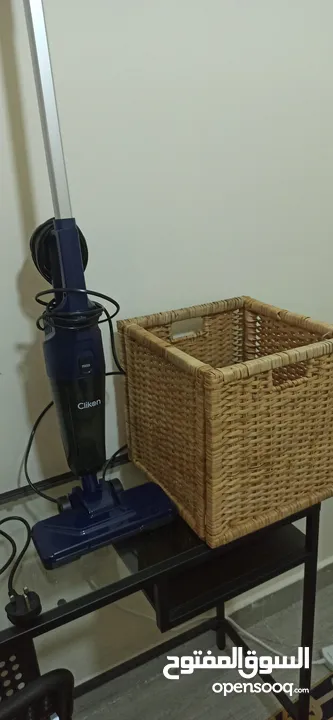 Ikea table + chaire + Landry basket + basket of clothes + vacuum + water hotter and toast cooker