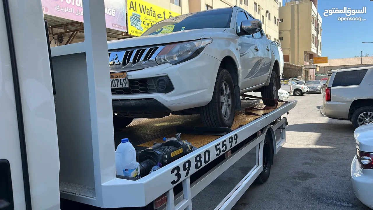 سطحة مدينة حمد 24 Hamad Town TOWING CAR 24 ونش رافعة رافعه نقل سطحة البحرين خدمات سحب سيارات