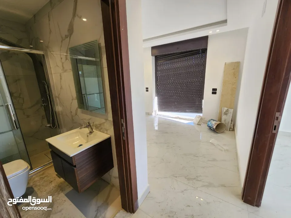 شقة مع روف دوبلكس للبيع على طريق المطار ( البنيات )  ref : 14367