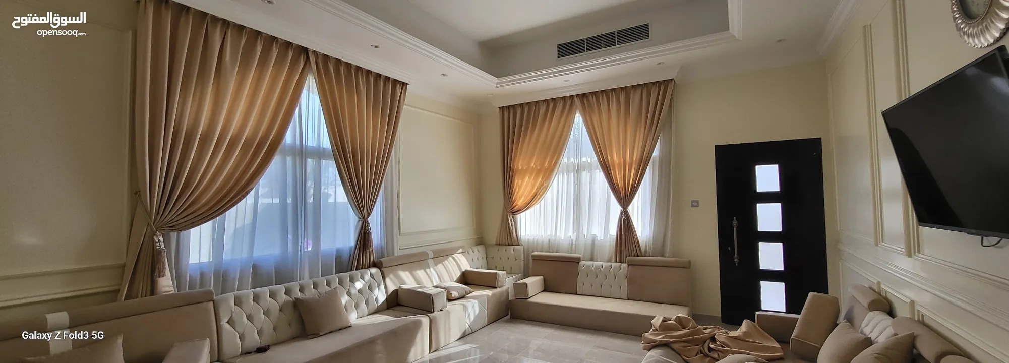 Quality House curtains and sofa