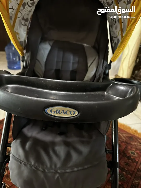 عرباية اطفال مع مقعد سيارة نوع GRACO