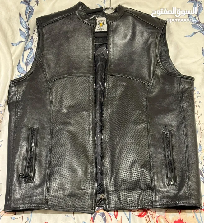 Original leather Biker’s vest and various helmets