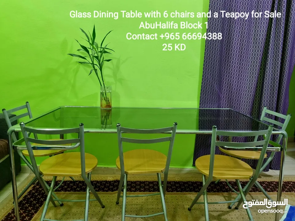 Glass Dining Table with 6 chairs and a teopoy