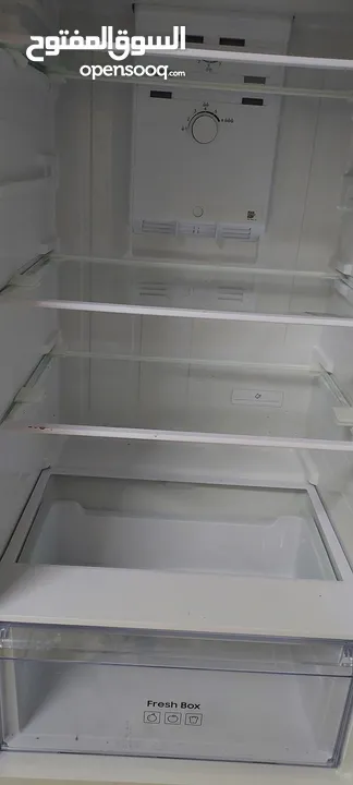 Almost new Samsung refrigerator, used for only 5 months, under one year warranty. Location: Al Ghubr