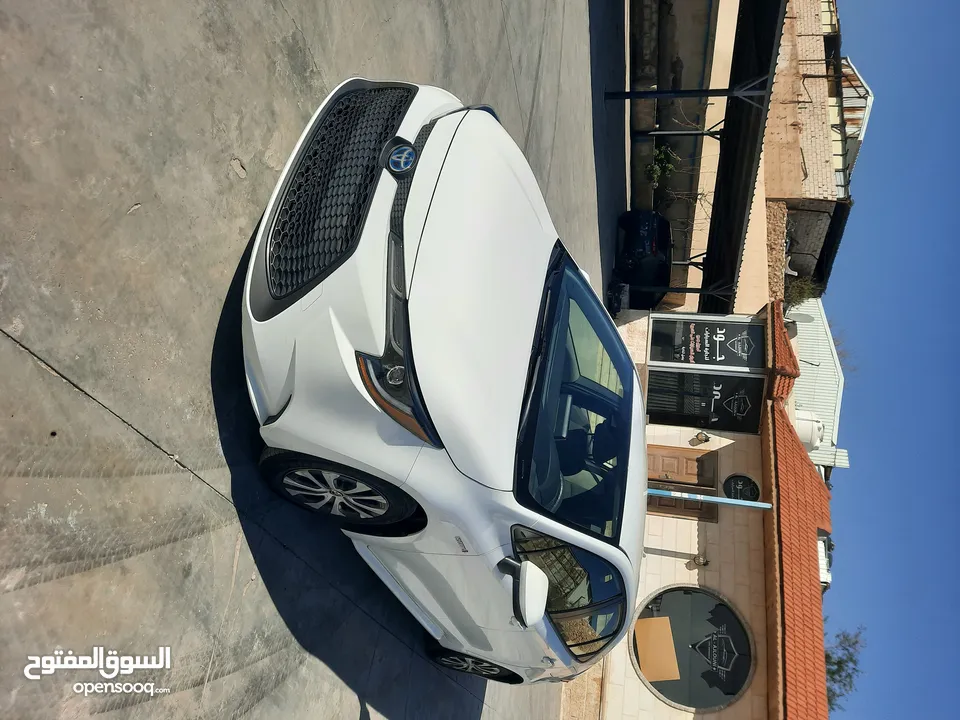 تويوتا كورولا وارد أمريكي بطاريه ليثيوم موديل 2021 لون ابيض