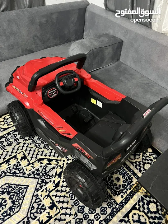 سيارة جيب حمراء للاطفال شحن