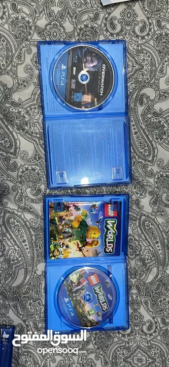Ps4 with two controllers and 4 games including overwatxh ultimate edition