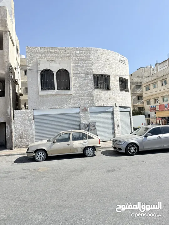 عمارة خلف الاستقلال مول بأول سوق النزهة الشعبي