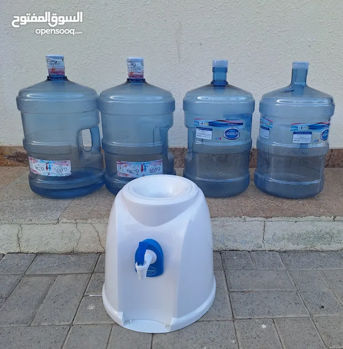 Four empty water bottles and coler.anybody interest please contract me.