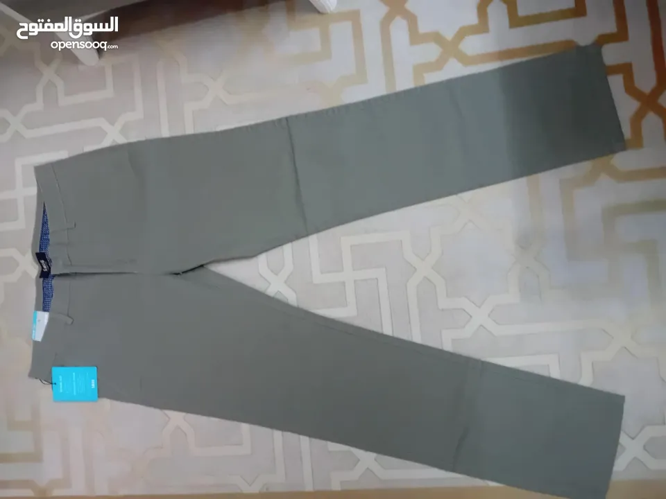 شروات ملابس رجالي بنطلون جينز وكتان وقميص وشرت البضاعه جديد البضاعه صنع تركي وصيني العدد 610