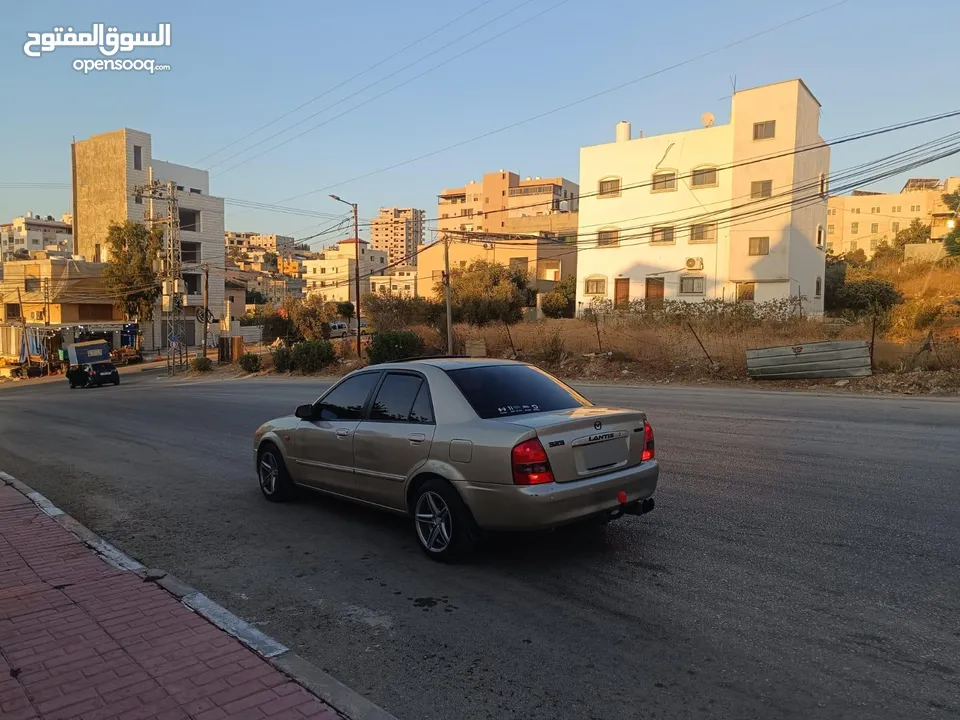 مازدا 323 اتماتك فتحه اصليه تحفه بمعنا الكلمه بسعر حرق 29500 ألف نقدا بدل وارد فحص نخب