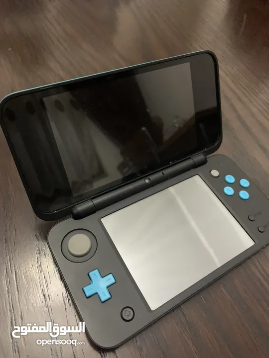 Nintendo 3DS XL   مع 8 العاب