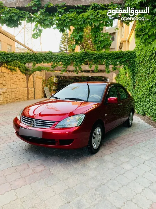 ميتسوبيشي لانسر 2009 بحالة الشركه 1600cc لون خمري للبيع