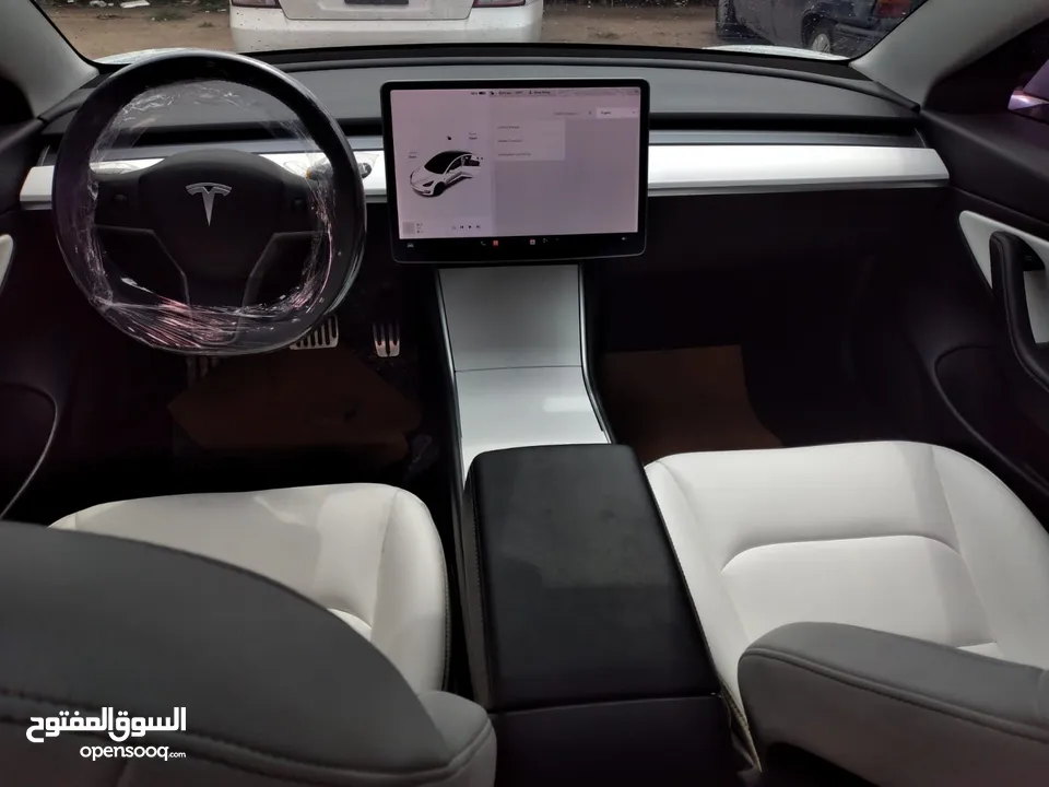 تيسلا 2021 ستاندرد بلس فحص كامل 4 جيد في المنطقة الحرة وارد امريكي داخلي ابيض