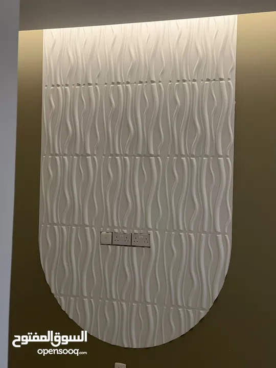 **3D wall panels** are decorative elements that add depth and texture to walls, creating a visually