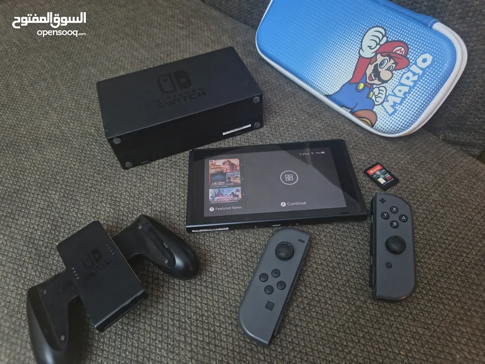 جهاز نينتدو سويتش حالة ممتازة جدا مع أغراضه ولعبة