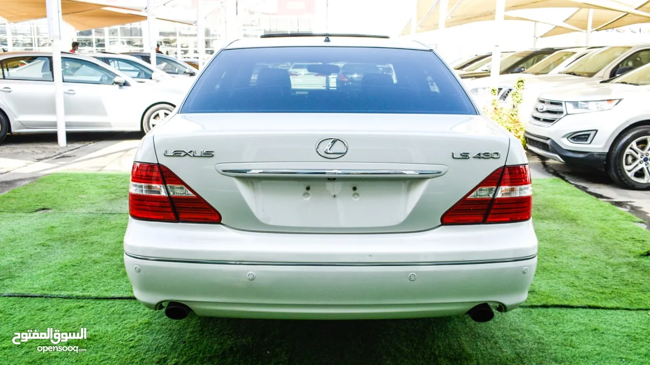 لكزس LS430 وارد 1/2 الترا موديل 2006 لون أبيض فتحة جلد رنجات خشب مرايا كهرباء بحالة ممتازة