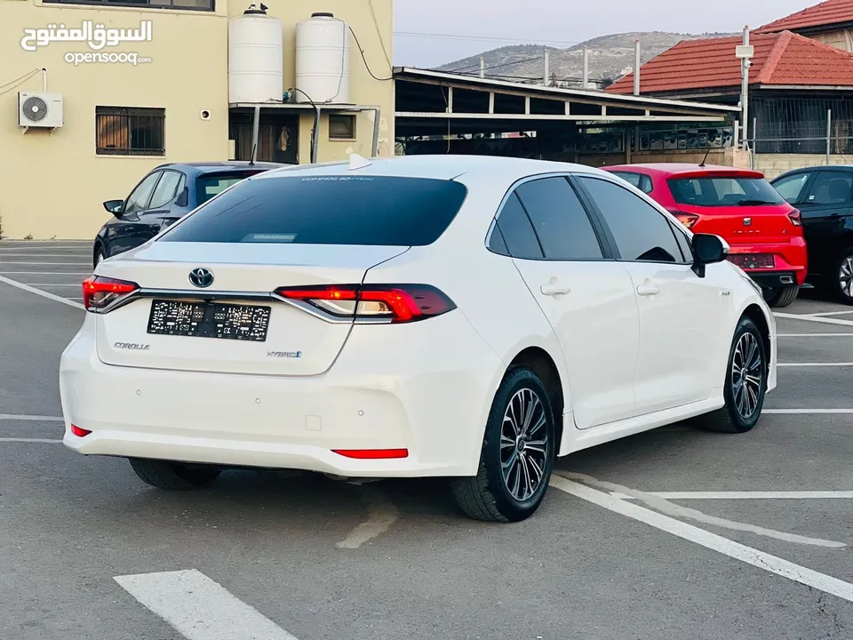 تيوتا كورولا هايبرد ترخيص 2022 فل بدون فتحة مميزة  ماتور 1800cc ( بنزين + كهرباء) 170Hp