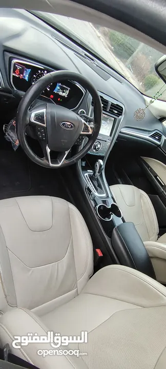 فورد فيوجن 2015 اعلى صنف تيتانيوم اصلي  بدون فتحه فحص كامل 7جيد