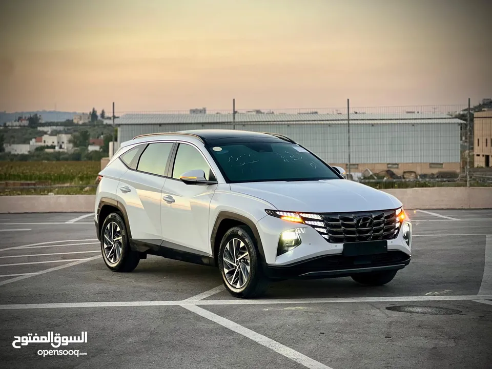 هونداي توسان 2023/ فل الفل فتحة سقف بانوراما  2x4 ///240Hp بنزين + كهرباء  ( Haybrid) 1600cc
