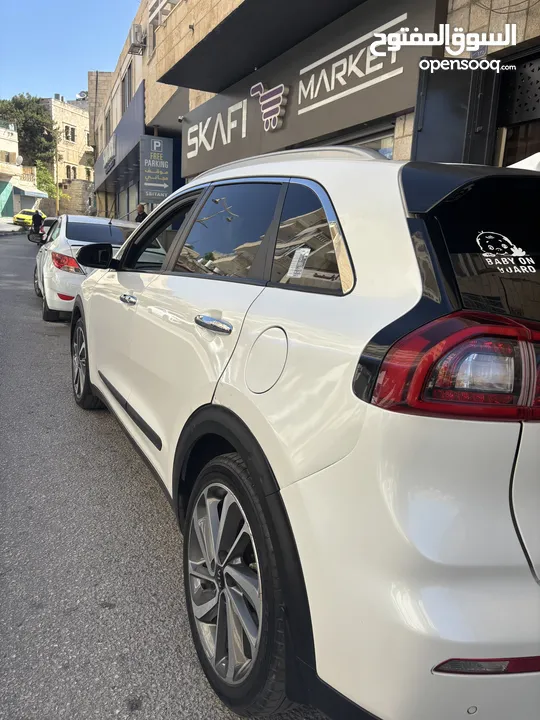 كيا نيرو 2019 -الاتصال على رقم الوطنيه في الوصف