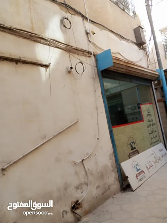 عمارة وسط السوق التجاري بين شارع السعادة وشارع الملك عبدالله