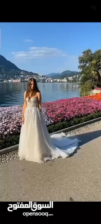 فستان ابيض لامع جديد ( غير مستخدم) مهر او زفاف