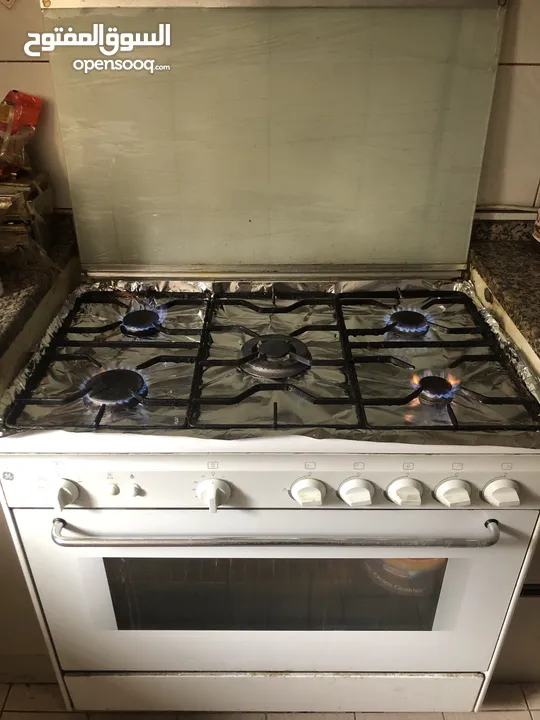 Cooking range with 5 burners and oven with conventional fan and other Accessories like tray etc