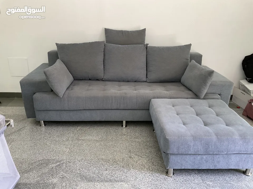 3 seater sofa with leg rest and pillows