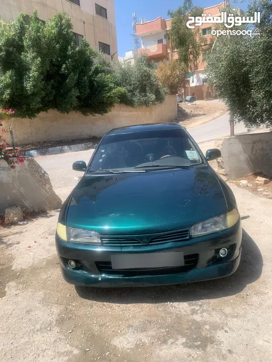 متسوبيشي لانسر 1997 موجوده في جرش في مجال للتفاوض بشي بسيط
