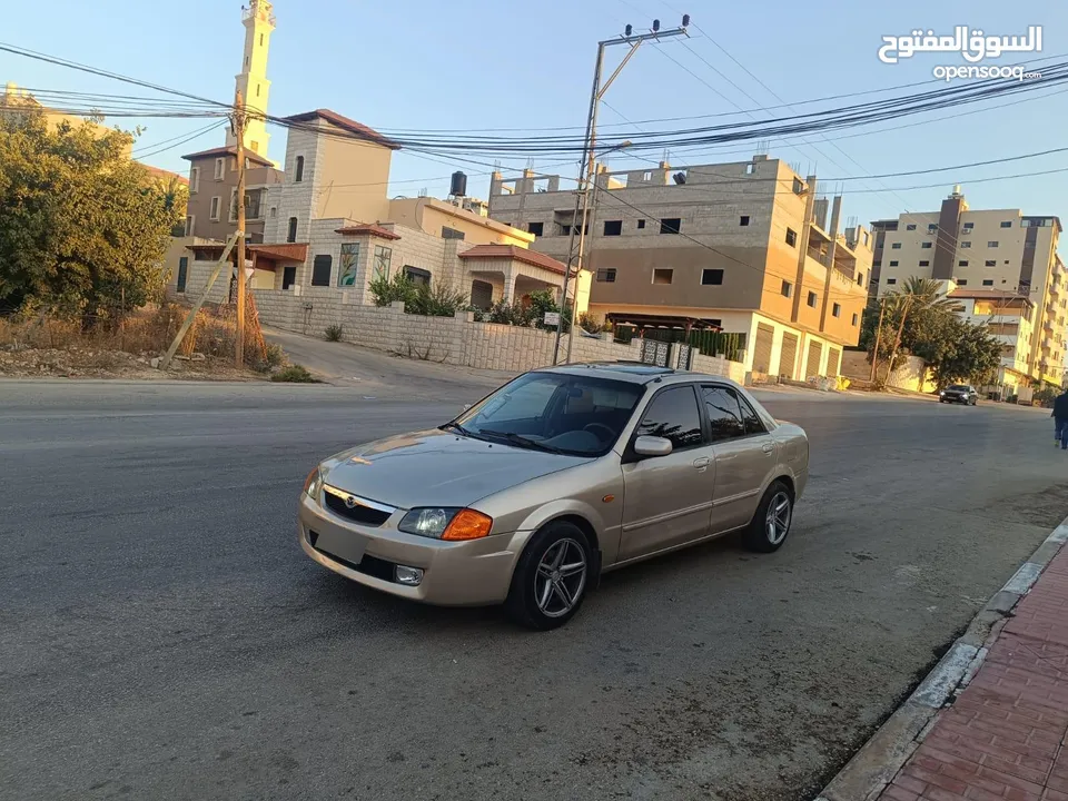 مازدا 323 اتماتك فتحه اصليه تحفه بمعنا الكلمه بسعر حرق 29500 ألف نقدا بدل وارد فحص نخب