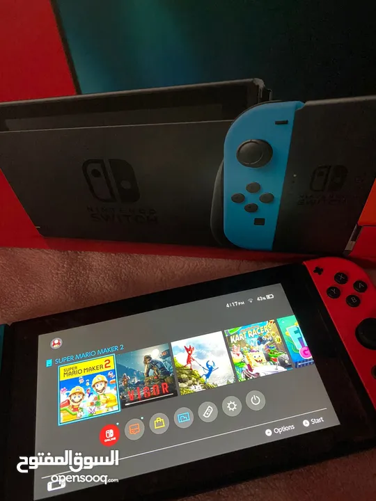 يتوفر Nintendo switch متحدث لاخر اصدار مع الملحقات من جوستك وشاحنة+رام تخزين32غ ولعبة ماريو