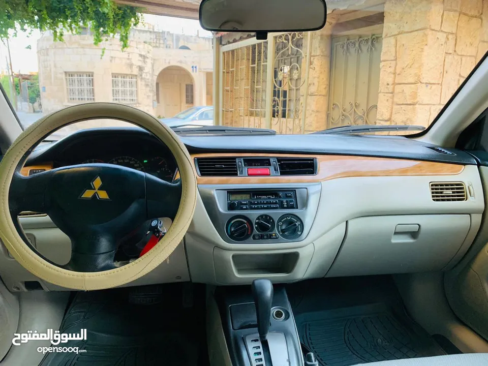 ميتسوبيشي لانسر 2009 بحالة الشركه 1600cc لون خمري للبيع